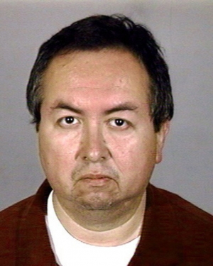 This police booking mug from the Los Angeles Police department shows former Catholic priest Carlos Rene Rodriguez, 46, after he was arrested at his home in the City of Commerce, Calif., Wednesday Sept. 25, 2002. (AP Photo/Orange County Sheriffs Department)