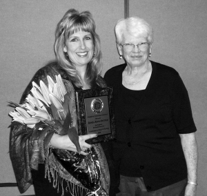 Pictured is Ronda Reyes-Deutsch receiving her honorary plaque as a dedicated middle school counselor now at Fillmore Middle School. This is being presented by the Executive Director of PDAP, Ginny Connell.