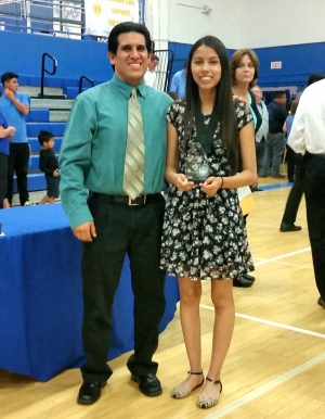 Fillmore High School graduating senior, Alondra Ramos (right) is the recipient of the 2016 Rosie Torres Scholarship For Future Teachers. Michael Torres (left) recently presented the award at an on-campus ceremony.