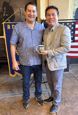Fillmore Rotary Club President John Garnica, pictured above, presents a Rotary mug to last week’s guest speaker, Isaac Huang, Assistant Superintendent of the Fillmore Unified School District. Photo credit Martha Richardson.