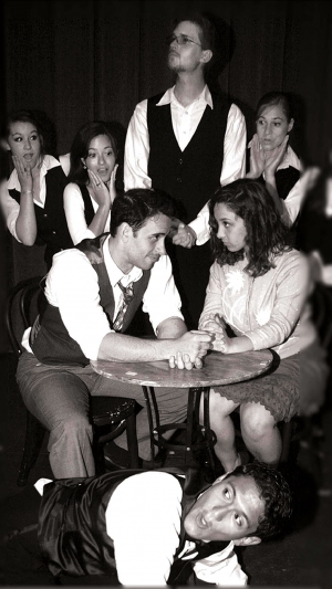 Georg (Geoffrey Helms) and Amalia (Danielle Protugal), seated, share an uncomfortable moment with the busboys and waiter at the Cafe' Imperial in SHE LOVES ME.