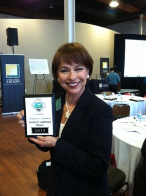 Anna Frutos-Sanchez, Regional Manager Local Public Affairs, with the membership plaque.