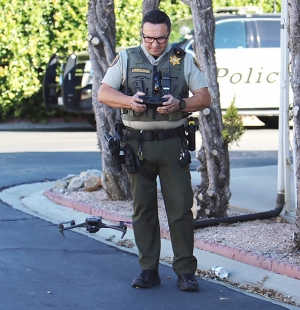 A Fillmore Sheriff’s deputy launching a drone from El Dorado Mobile Homes in search of the attempted murder suspect who was eventually located near Pole Creek on 4th Street. Photo credit Sebastian Ramirez.