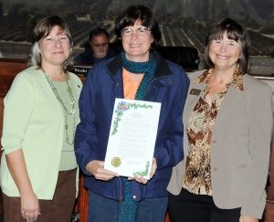 A Proclamation accepted by Lynne Brooks (center) recognizing the Soroptimist’s efforts on behalf of Breast Cancer Awareness and Domestic Violence Prevention Month. Also pictured Patti Walker (left) and Mayor Gayle Washburn (right).