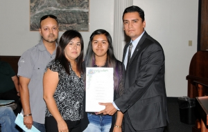 The family of Adrian Moreno received a Proclamation from Mayor Manuel Minjares honoring their son. Adrian was
killed in a shooting on Grand Avenue in January 2014. The homocide remains unsolved. Pictured are his parents
Jorge and Elida.