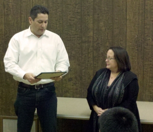 Boardmember John Garnica presents Jan Marholin with a Certificate of Appreciation at Tuesday night’s meeting.