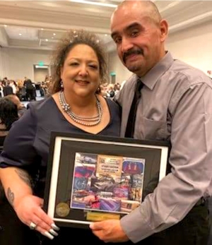 (left) Sonia Chessani with Good Times Car Club Founder Paul Sanchez at the National Lowrider Hall of Fame induction
ceremony.