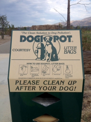 Keeping the trail clean for others to enjoy. DogPots are available along bike path for dog-owner convenience.