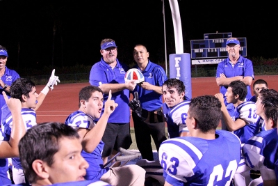 Coach Dollar and Mr. Ito Pose with the Helmet