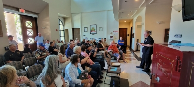 On Saturday, July 29th at 10:30am, Fillmore City Hall was filled with folks to celebrate the Fillmore Police Department Plaque Dedication Ceremony and BBQ, in honor of members of the Fillmore Police Department who served the community from 1925 to 1987. Above, Duke Bradbury, Former Fillmore peace officer and current President of the Thin Blue Line of Ventura County, introducing speakers before the plaque unveiling. See more photos on page 10. 