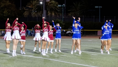 Above are the Cardinals and Flashes JV and Varsity Cheer Squads during their halftime performance. Photo credit Crystal Gurrola.
