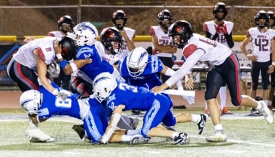 On Friday, September 12th, Fillmore Flashes Varsity hosted their annual Youth Night as they took on Grace High School. Above is FHS defense putting a stop to a Grace player during Friday night’s game. Inset, Flashes JV played Oxnard High School; a Flashes player ran the ball up the field as teammates cleared his path during Friday’s game. FHS defeated Oxnard, 14-6. Photo credit Crystal Gurrola. 