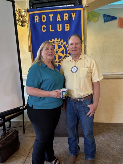 Pictured (l-r) are District Governor Marta Brown and Rotary President Scott Beylik presenting her with a Rotary mug. Photo Martha Richardson. 