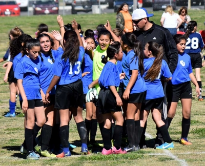 Coach Lomeli and the California United U-12 Girls getting a break after their win at home against Oxnard National. Photo Courtesy Martin Hernandez.