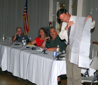 Fillmore Director of Public Works, Bert Rapp, shows a map of the city’s 11 storm drains, which flow into the Santa Clara River. A workshop on the new storm water permit and water softener prohibition was held Monday, July 7. Several hundred residents attended.