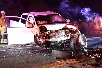 The above photo shows the damage to the white Chevy pickup truck involved in a head-on collision with a CHP vehicle. Photo credit Angel Esquivel.