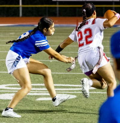 Above is Lady Flashes #9 trying to snatch the Hueneme player’s flag during last Tuesday’s game. Photo credit Crystal Gurrola.