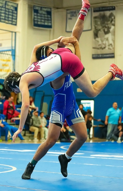 Above is Fillmore’s Gonzalo Landeros vs. Anthony Luna of Santa Paula High School during the Citrus Coast League Wrestling finals on Saturday, February 8. Photo credit Daniel Cruz and Jimmy Torres Jr.