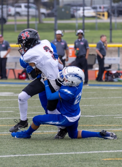 Pictured above is a Flashes JV player making a tackle in last Friday’s game against Hart High School. Photo credit Crystal Gurrola.