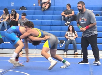 Pictured above is Flashes James Alcantar taking on a Buena High opponent. James finished the tournament 2-1 overall. Photo credit Michael Torres.