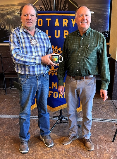 Pictured is Fillmore Rotary President Scott Beylik presenting speaker Chris Brashears, who shared about Central Coast Free Vision Clinic, with a Rotary mug. Photo credit Martha Richardson.