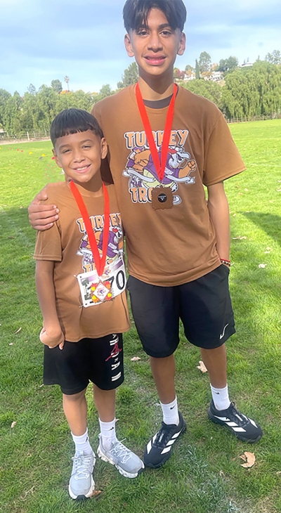Pictured is Fillmore’s Damian Santa Rosa and his brother Jacob, medal winners at the Santa Clarita Valley Turkey Trot.