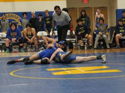 Fillmore High Wrestling Team competed in the Citrus Coast League Matches vs. Santa Paula High School, Channel Islands High School, and Nordhoff High School. Above is Fillmore High JV Wrestler Marcus Lopez taking his opponent to the matt during his match against Nordhoff High School. Inset, FHS Varsity’s Tony Lemus in his match against Nordhoff High. Photo credit Michael Torres, M. Ed., FHS Wrestling Coach. 