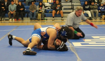 Above is Fillmore Varsity Wrestler Pedro Diaz taking down a Cardinal in his match against Santa Paula. Inset, Varsity’s Gonzalo Landeros in his match against Santa Paula High. Photo credit Michael Torres, M. Ed., FHS Wrestling Coach. 