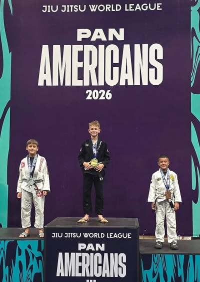 Above, Dax Camacho (far right) celebrates earning two bronze medals at the JJW League Pan American Championship. Photo credit Michael Torres.