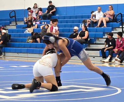 Above is Flashes Jackie Rivera taking her Santa Paula opponent to the mat during her match at the Summer Tournament this past Saturday. Photo credit Michael Torres.