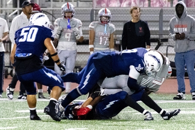Above are Fillmore Flashes Varsity players make a tackle during their game against Hueneme High School this past Friday. Photo credit Crystal Gurrola.
