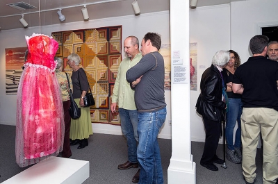 Two visitors viewing the Linda Taylor dress. Photographer Les Dublin
