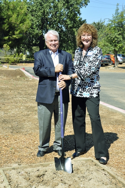 Congressman Elton Gallegly helps Cyndy Treutelaar, president of the Humane Society of Ventura County board, shovel the first pile of dirt.