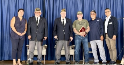 The Grand Marshals and guest speakers were given certificates of recognition and plaques for their contributions. Pictured (l-r) at the Veterans Day ceremony are Fillmore Mayor Pro Tem Christina Villasenor, with Grand Marshals Ismael Alonzo and Victor Westerberg, and guest speaker former Police Chief and Marine veteran Richard “Dick” Diaz., Fillmore Knights of Columbus Grand Knight Bob Gradias and Supervisor Kelly Long’s Representative Manuel Minjares. Inset, Fillmore VFW leading the parade down Central Avenue. Inset photo credit Angel Esquivel-AE News. 