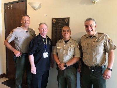 On Saturday, July 29, 2023, a Dedication ceremony was held at Fillmore City Hall for the unveiling of the plaque to hang in the lobby of City Hall to honor Fillmore Police Department members who served the community from 1925 to 1987. Pictured above are VCSO Commander and Camarillo Chief of Police Eric Tennessen, President of Thin Blue Line of Ventura County Duke Bradbury, Fillmore Police Chief Eduardo (Lalo) Malagon, and Commander Garo Kuredjian, who were in attendance for the ceremony. 
