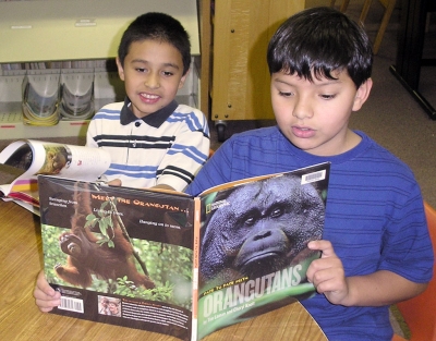 Adrian Hernanadez and Ben Prado having a great time at the library.
