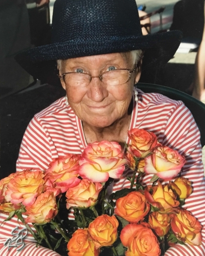 Marge Aguirre holding a bouquet of her beautiful roses.