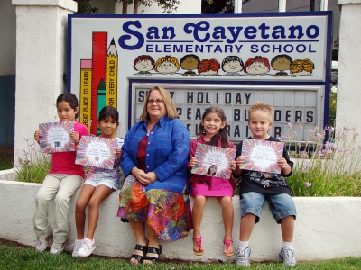 San Cayetano Principal Jan Marholin is shown with the Peacebuilders for September: (l-r) Isabela Regalado, Alyssa Andrade, Elissa Johnson, and Austin Gunter. Congratulations!