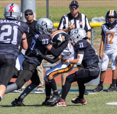 Pictured above are Raider Juniors #87 & #11 making a tackle against the Ventura Packers last Saturday, September 28. Final score, Raiders 0–Ventura 35. Photo credit Crystal Gurrola. More photos online at www.FillmoreGazette.com.