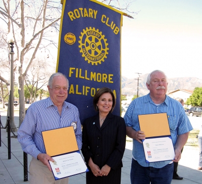 Paul Harris Award recipients (l-r) Bill Shiells, District Governor Luz Maria, and Dave Wilkinson.