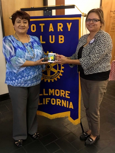 (l-r) Martha Navarette was presented a Mug from Rotary member Ari Larson, for speaking to the group about all Santa Clara Valley Hospice has to offer. Photo Courtesy Martha Richardson.