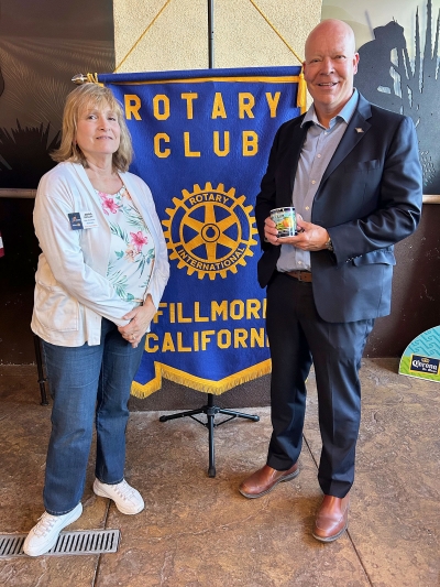 At last week’s Fillmore Rotary Club meeting President Anna Reilley presented speaker Martin Erickson with a Rotary mug. Photo credit Martha Richardson.