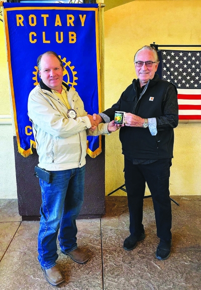 Pictured (l-r) is Fillmore Rotary President Scott Beylik presenting a mug to Rotarian Reverend George Golden for sharing his story with the club. Photo courtesy Martha Richardson.