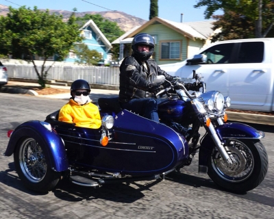 Ruthie and her driver Jim Estes riding away in front of her family, friends and neighbors. 