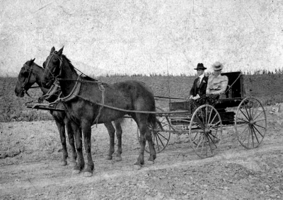 Cyrus and Elvira Kenney out for a ride.
