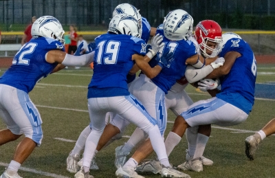 On Friday, August 25, 2023, Fillmore Flashes Football took on Burroughs High. Above is the Flashes stopping a Burroughs player in his tracks at Friday’s game. Inset, Flashes Varsity #41 as he makes his way to end zone to score for the Flashes. Photos courtesy Crystal Gurrola. 