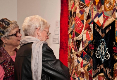 Visitors Viewing 1884 Haggerty Crazy Quilt. Photographer Myrna Cambianica
