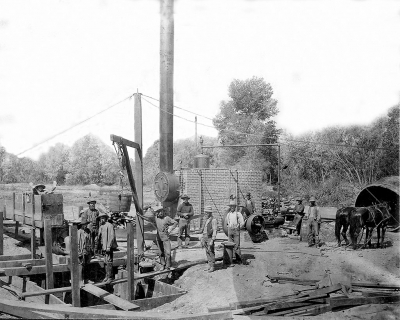 Men drilling the first water well on the Stringtown Ditch at Shiells Canyon.
