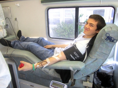 FFA member Marc Zavala donating blood at the annual FFA Blood Drive.