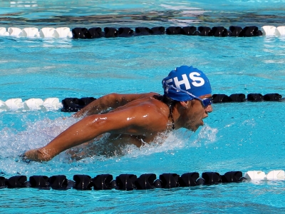 Sam Guzman swimming the 100 yd. butterfly.